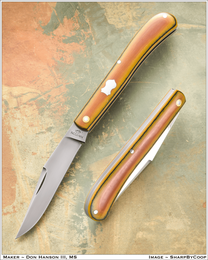Two brown knives kept on a surface